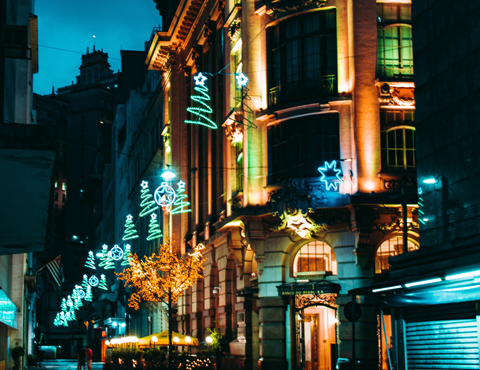 Hotel entrance and city street at night