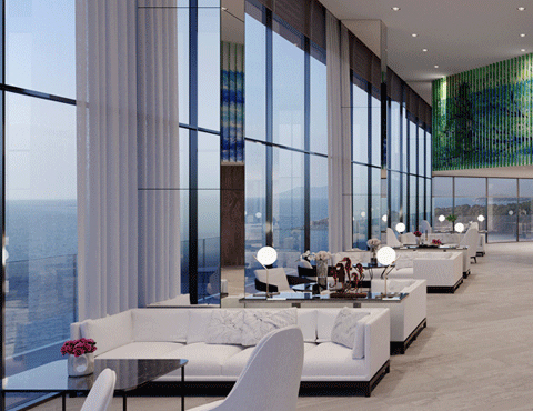 Bar setting in a high-end hotel with rows of white couches next to floor-to-ceiling windows